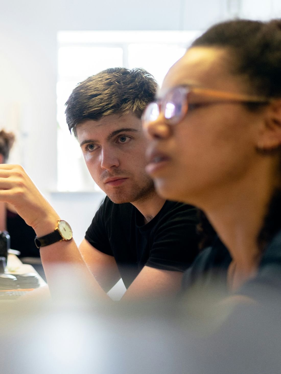 A founder and a growth lead working through a problem together at a screen