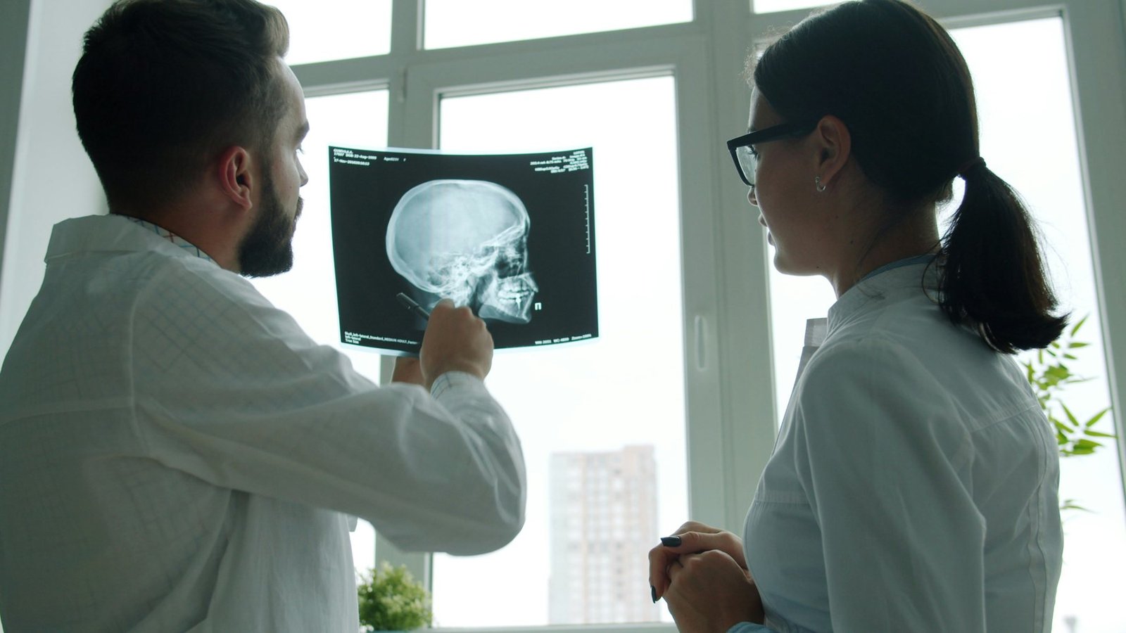 Two clinicians reviewing an X-ray together