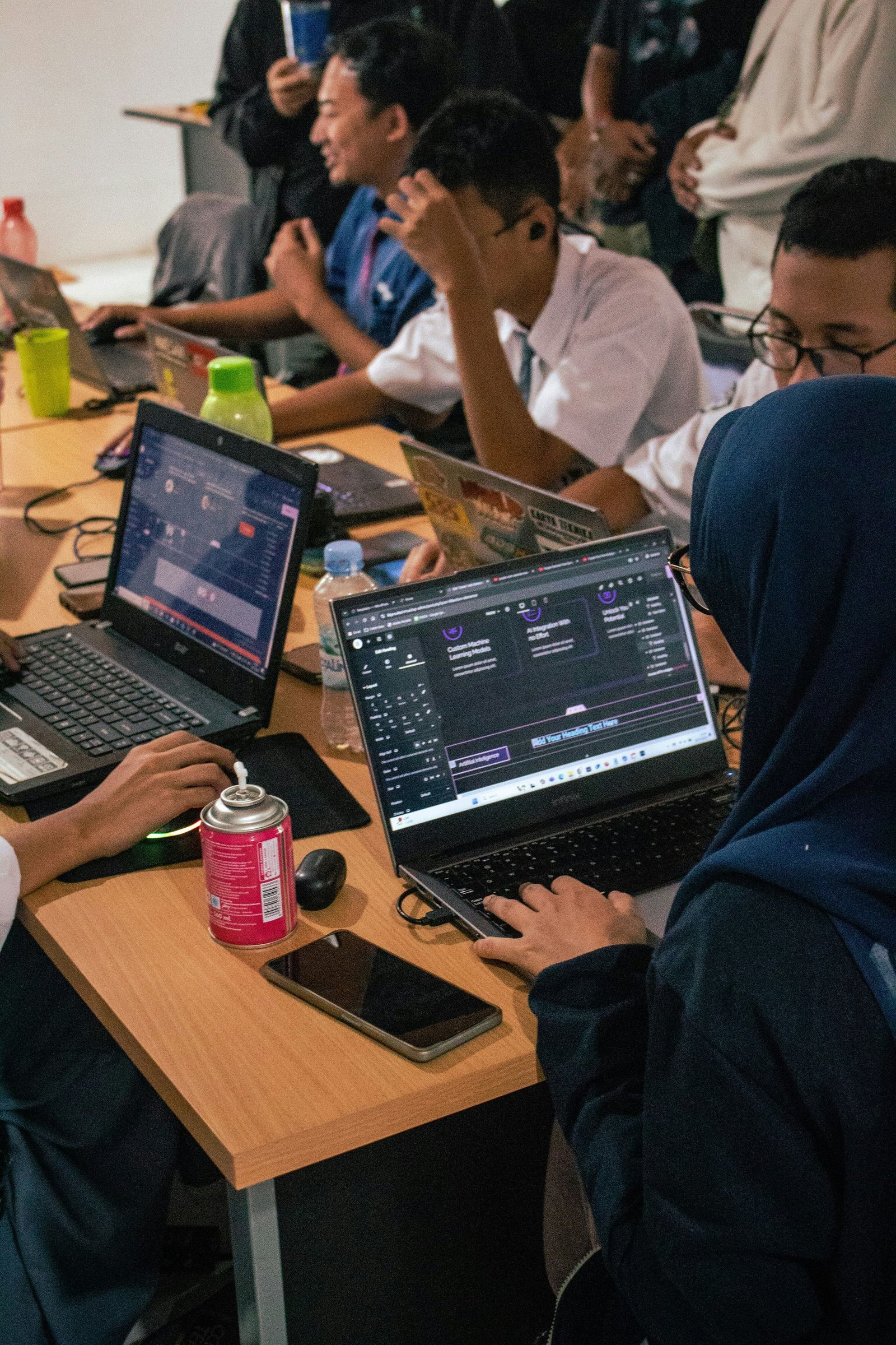 Founders working side by side on laptops