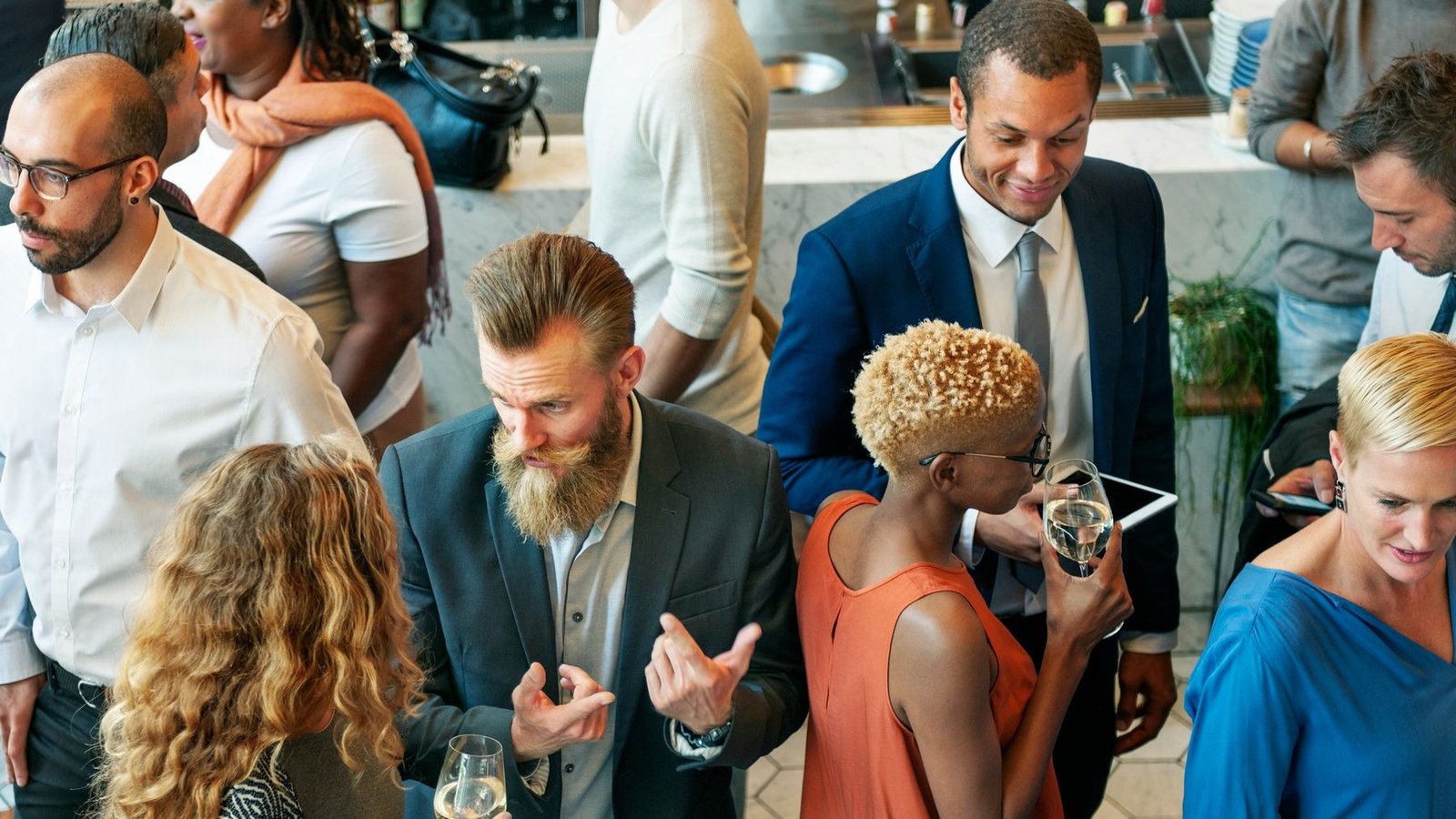 Professionals in conversation at a networking reception