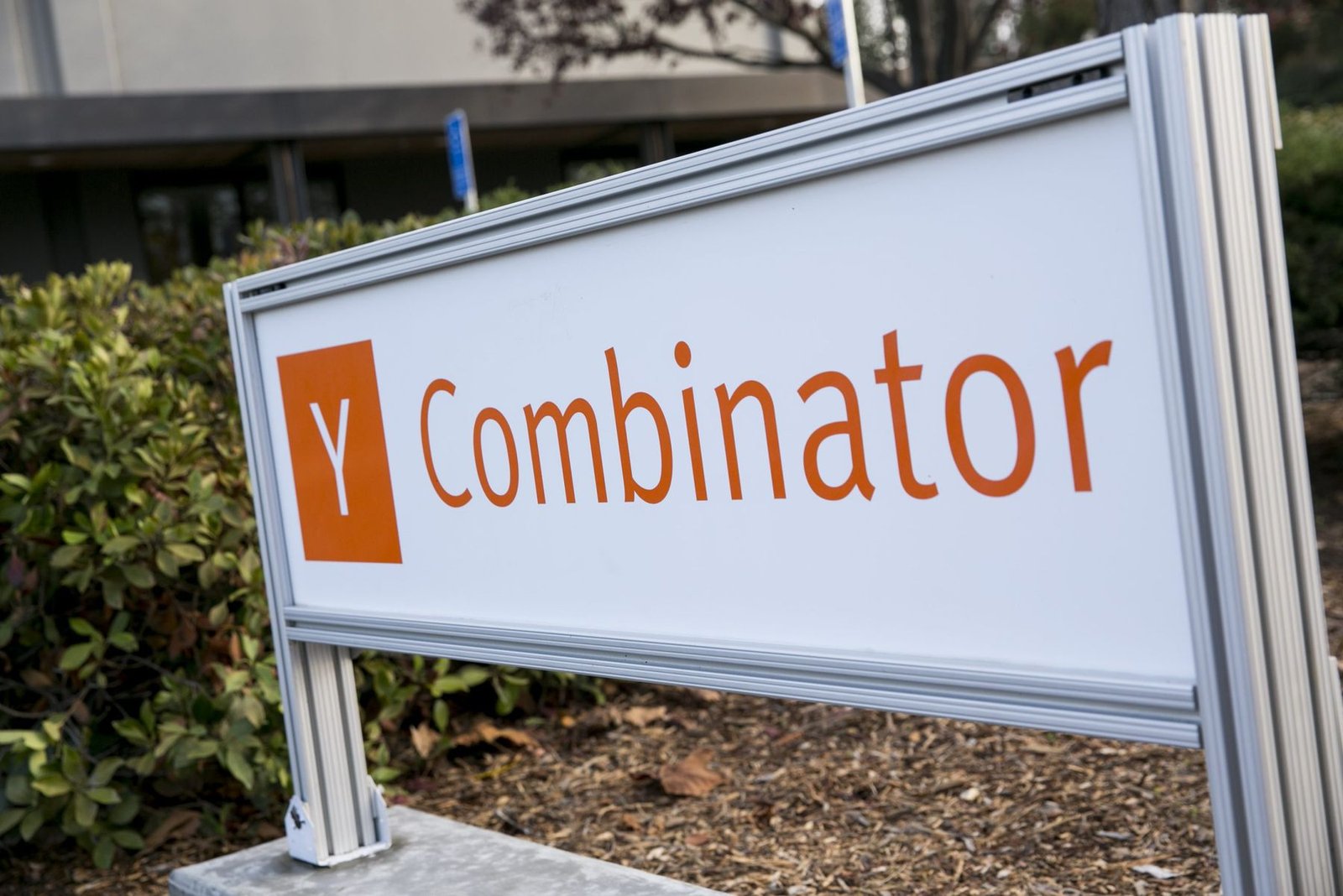 A Y Combinator sign outside an office building